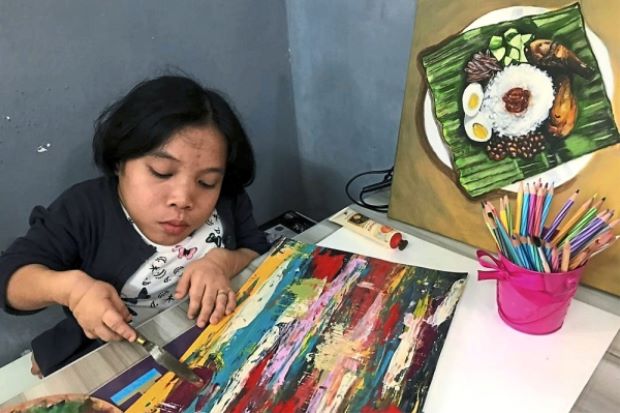 Rare disease unable to stop talented painter